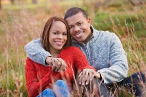 black couple in a field